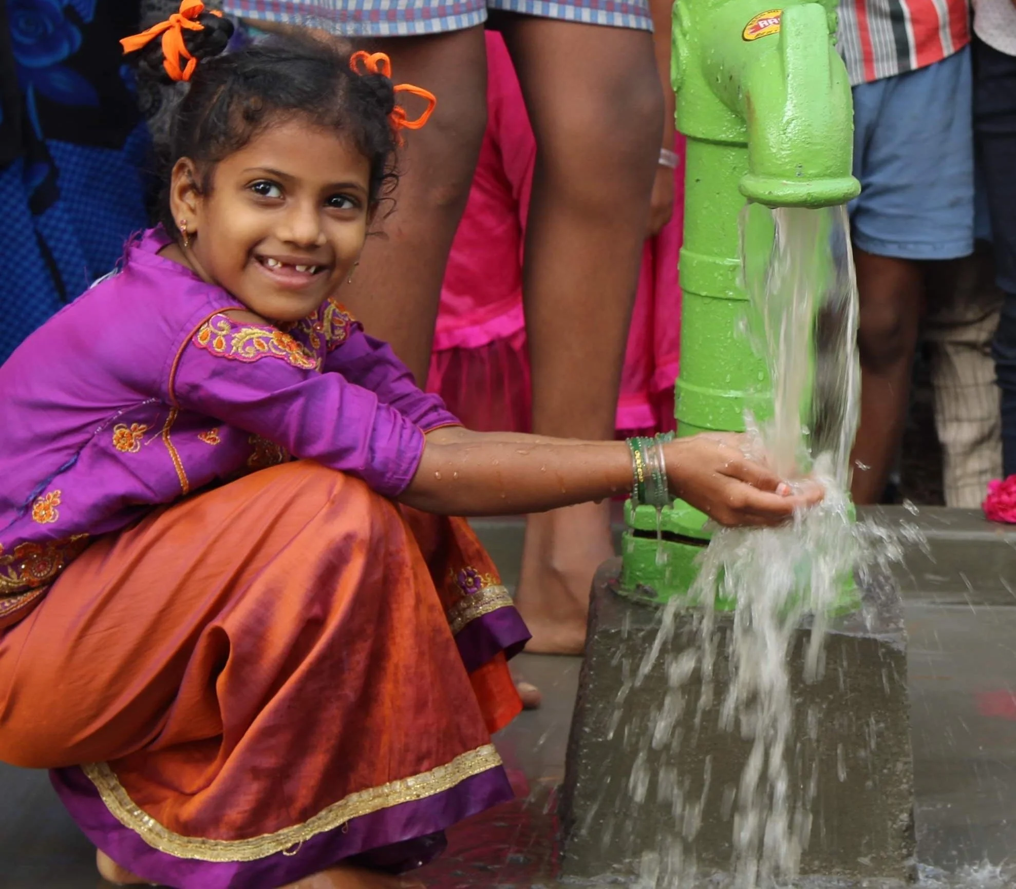 Clean water flowing from a donated well