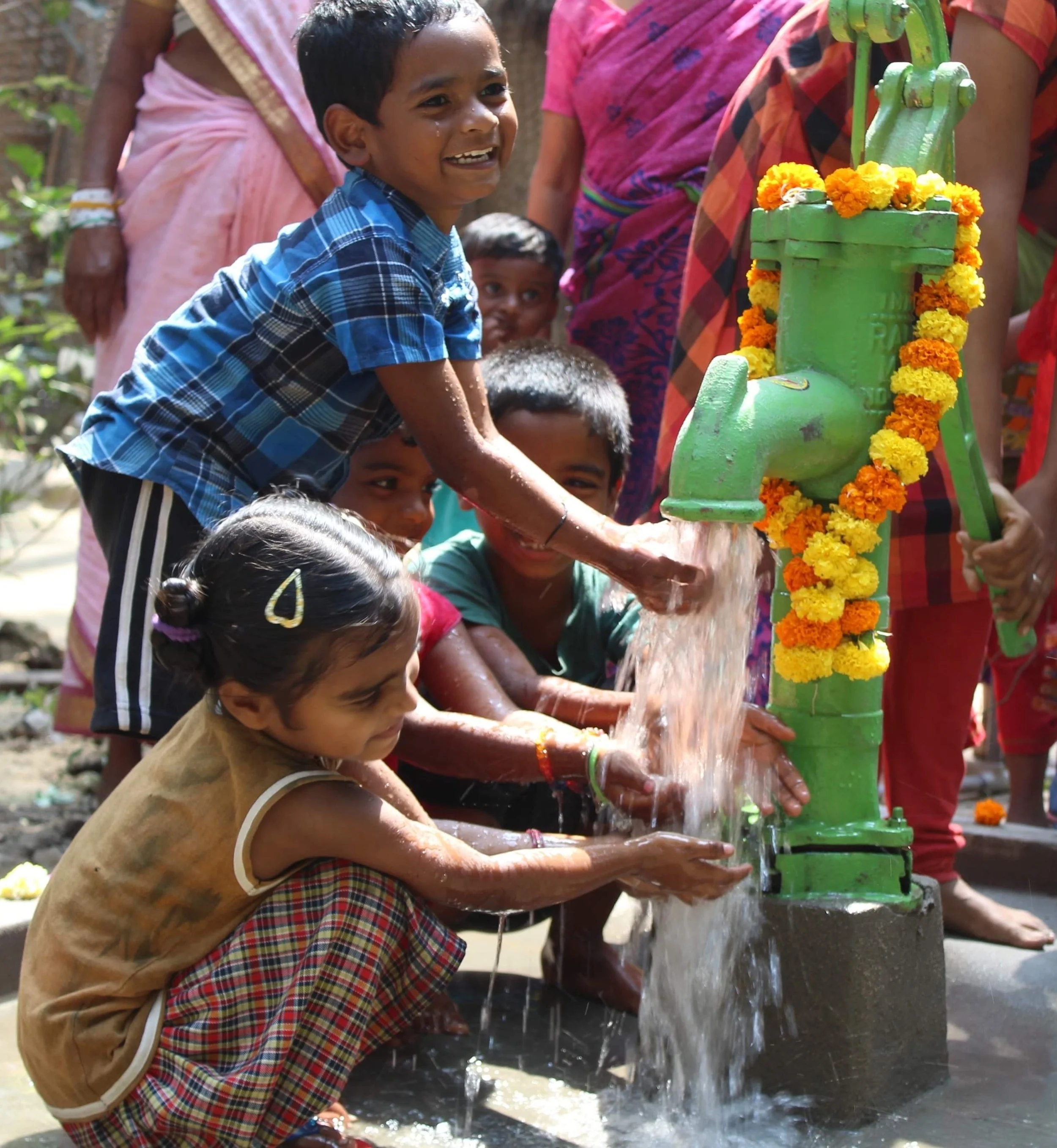A village gathered at a new water well
